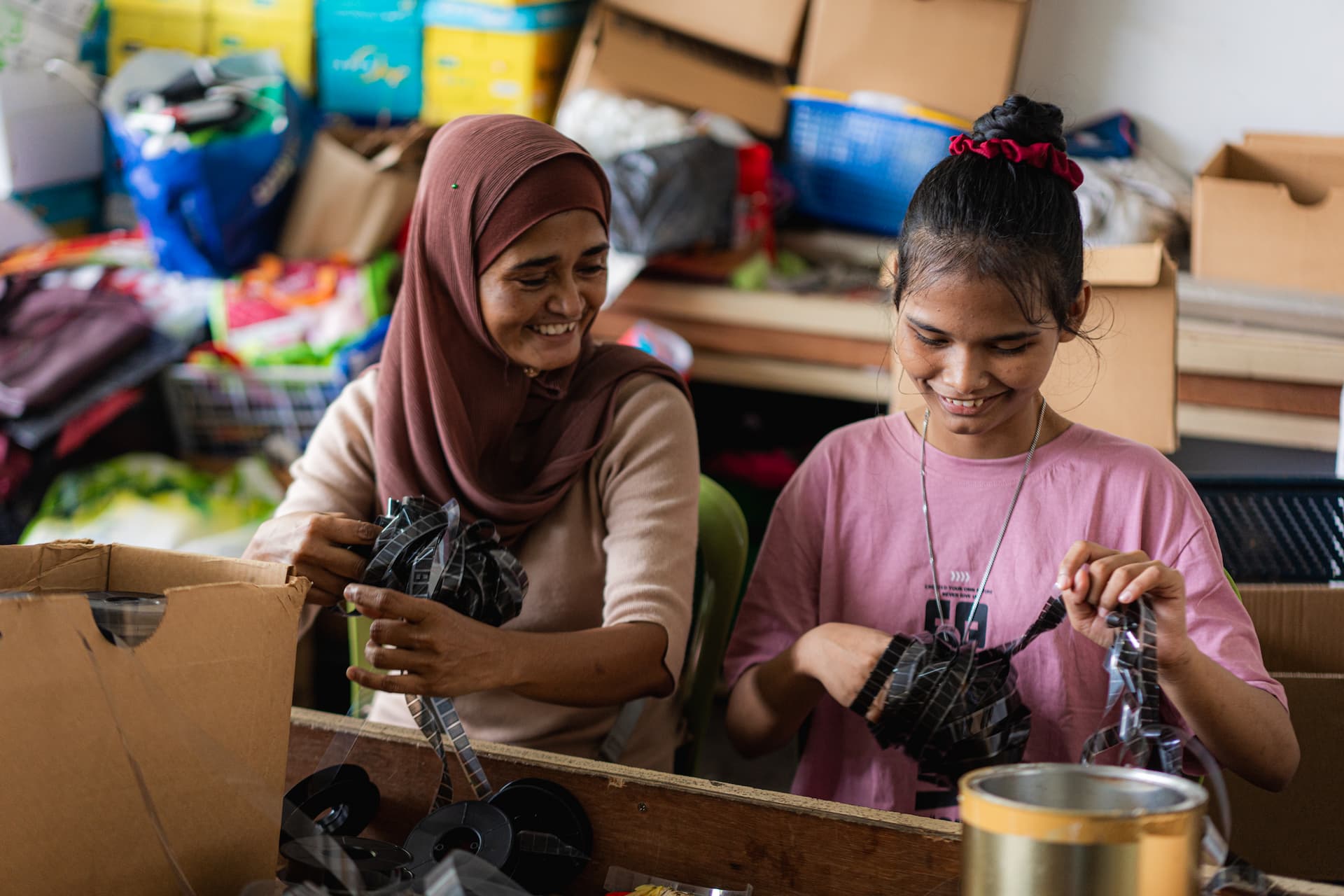 Alyssa, a 14-year-old refugee from Myanmar, spends her weekends volunteering with her mother, Zin Mar Aung, at the Tzu Chi Recycling Centre in Taman Meru, Klang, Selangor. For them, it’s more than just sorting recyclables—it’s a way to spend time together and give back to the community. © UNHCR/Azwan Fakaruddin